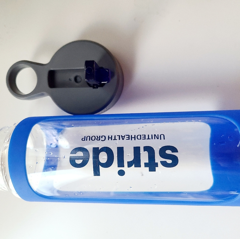 Glass woter bottle with grip sleeve ,preowne like new condition